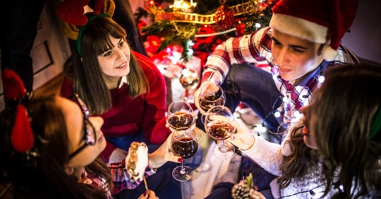 people drinking wine at holiday party
